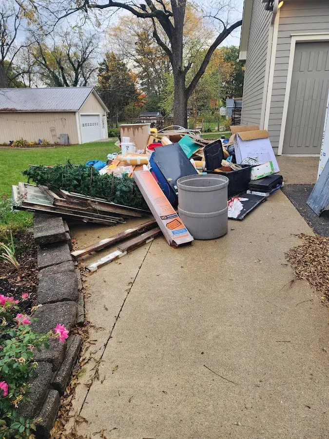 Dumpster being loaded with debris for 3 Yard Dumpster Rental in Berryville